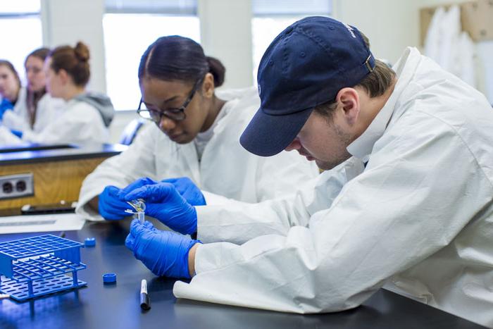 a couple of people in lab coats