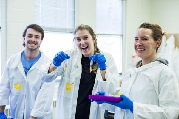 a group of people in lab coats