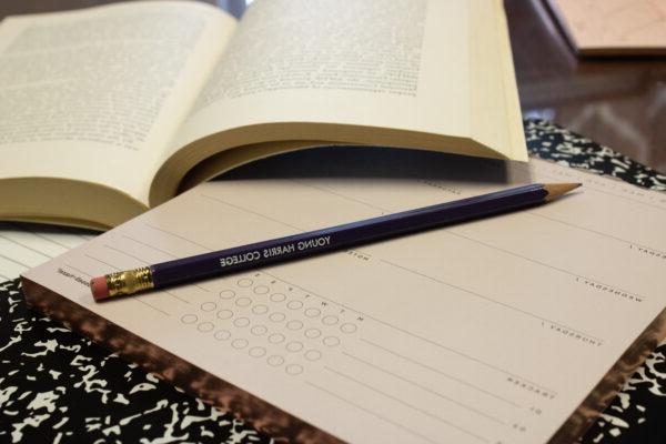 Close up of pencil and book